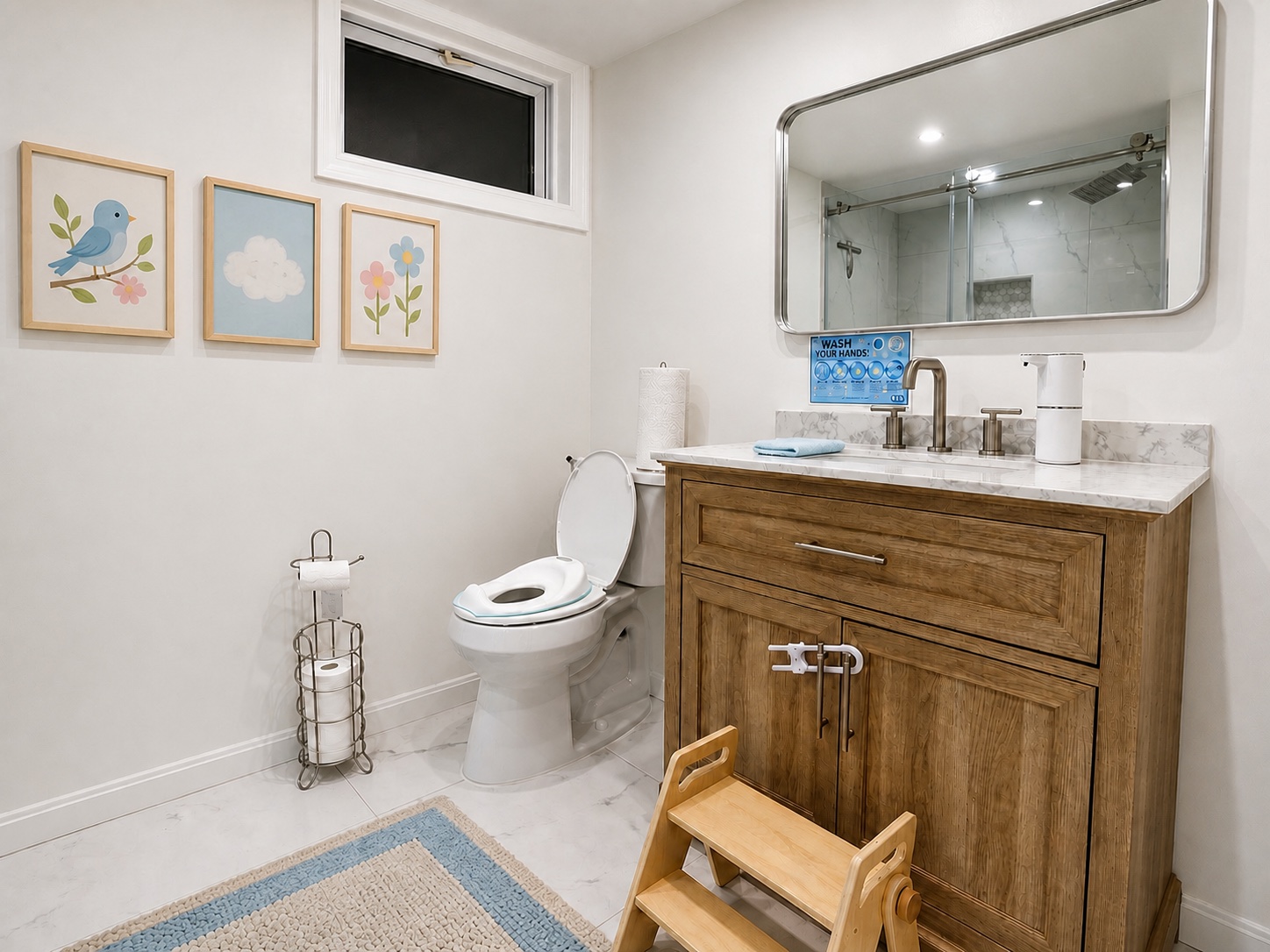 The clean, child-friendly Bluebird Learning Nest bathroom with a step stool, safety latch, sink, toilet, and handwashing guidance